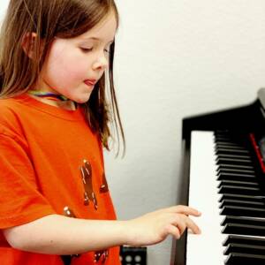 Little Girl Playing Piano | Summer Music Camps 